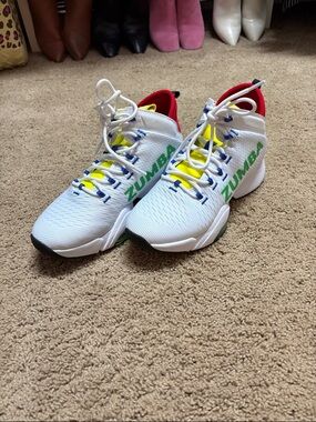 Zumba Fitness White Sneakers with Green Logo and Yellow Accents.
